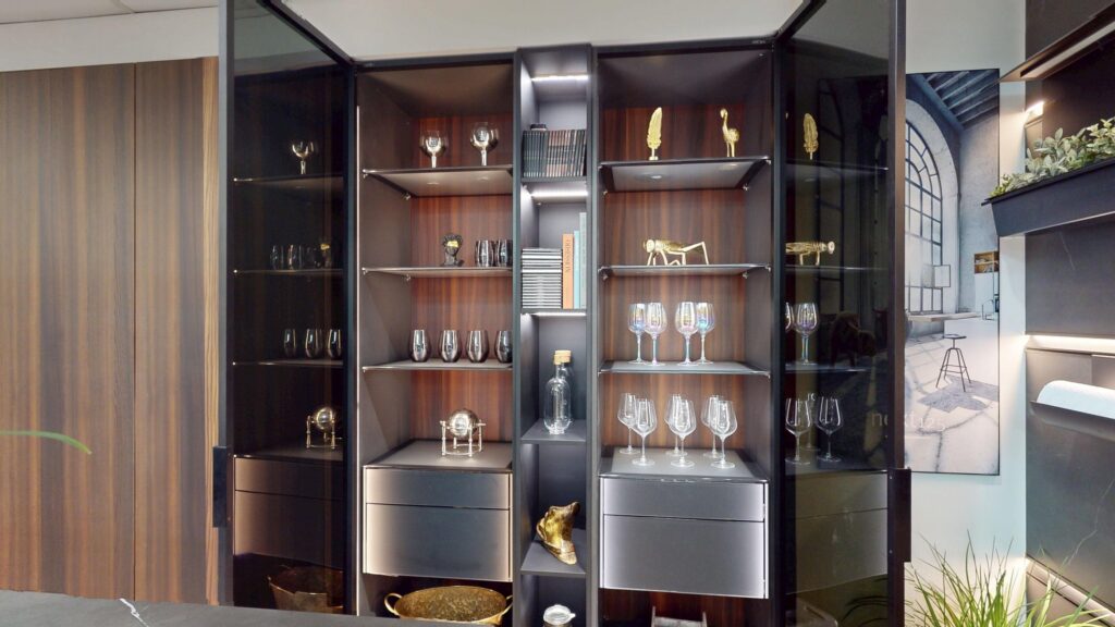Luxury smoked glass display cabinetry and bespoke storage design at Suga Küchen showroom